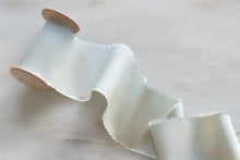 Load image into Gallery viewer, handmade and hand dyed with a hand torn frayed edge on a wooden spool