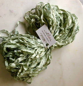 a bulk 50 yard bundle of recycled silk sari ribbon in a pretty Seaglass blue-green