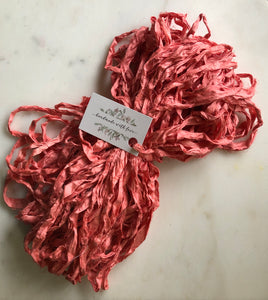 a large bundle of beautiful raspberry pink recycled sari silk ribbon